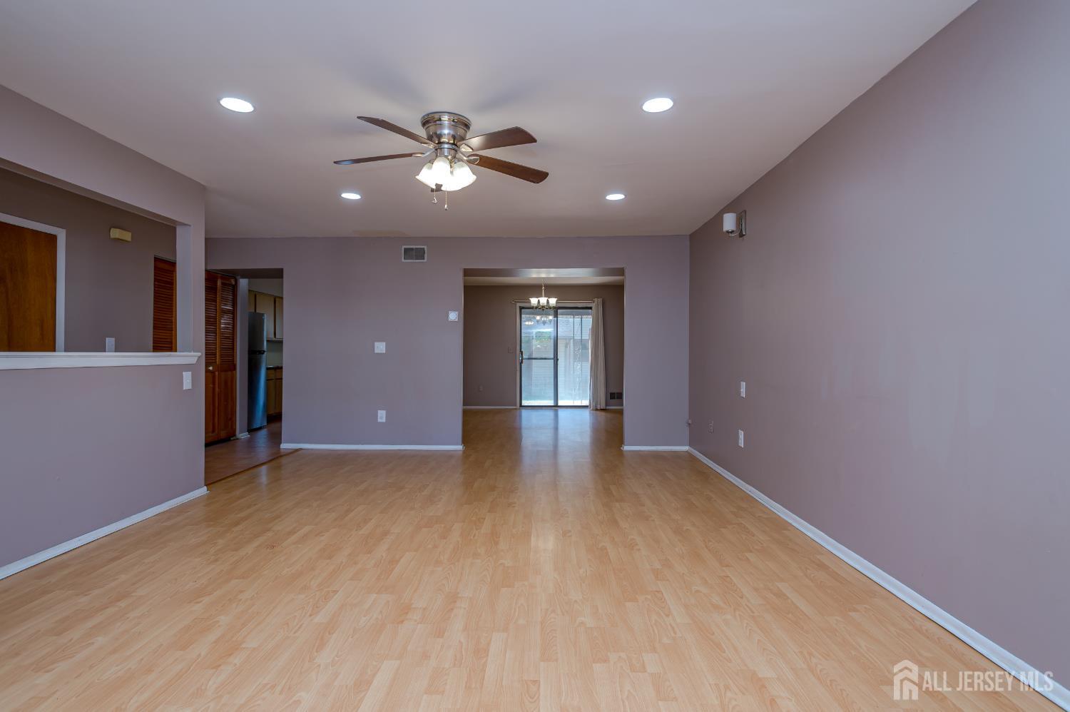 5601 Hana Road Edison, NJ 08817 - Photo 7 of 27 a view of an empty room with window and cabinet