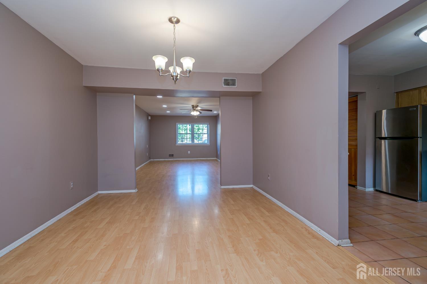 5601 Hana Road Edison, NJ 08817 - Photo 10 of 27 a view of livingroom and kitchen with window