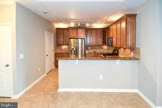 a room with a large window and a rug