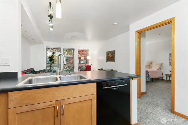 a kitchen with a sink and a refrigerator