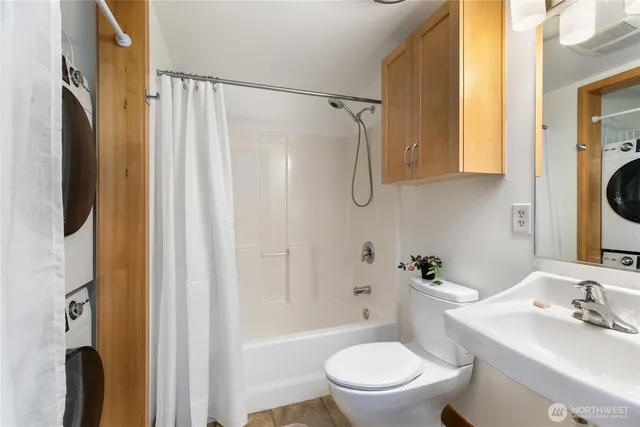 a white toilet sitting next to a bathroom sink