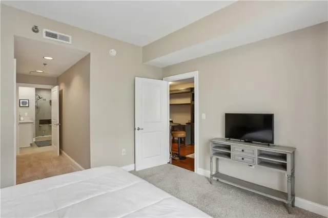 a view of a livingroom with furniture and flat screen tv
