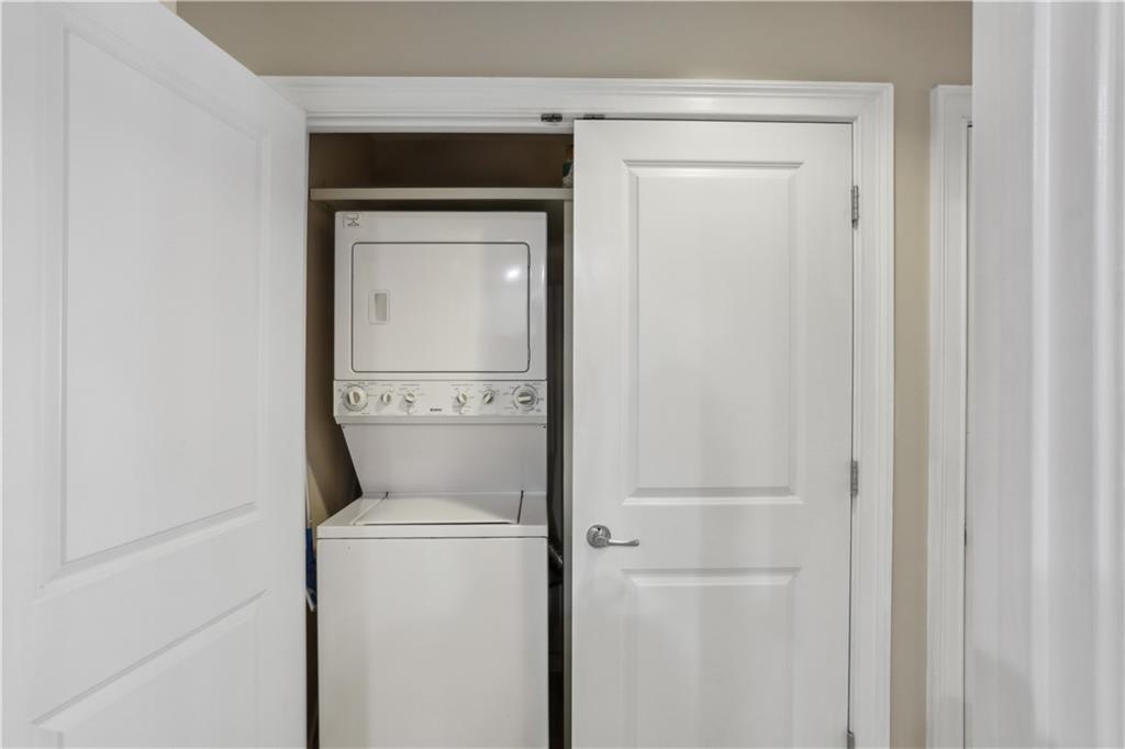285 Centennial Olympic Park Drive Northwest, Unit 1209 Atlanta, GA 30313 - Photo 10 of 17 a bathroom with a toilet and a sink