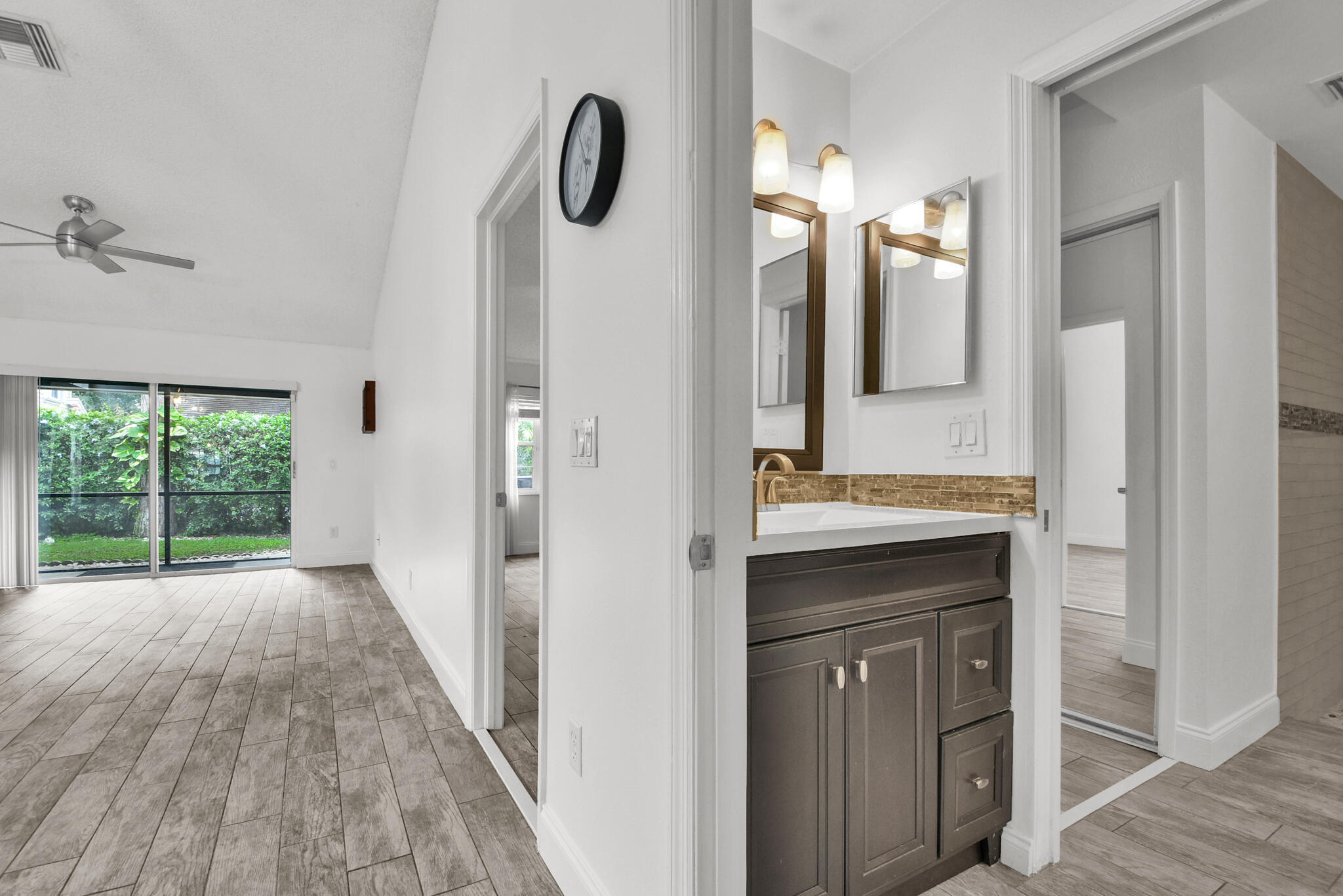 13175 Quiet Woods Road, Unit A Wellington, FL 33414 - Photo 11 of 46 a view of a bathroom from a hallway