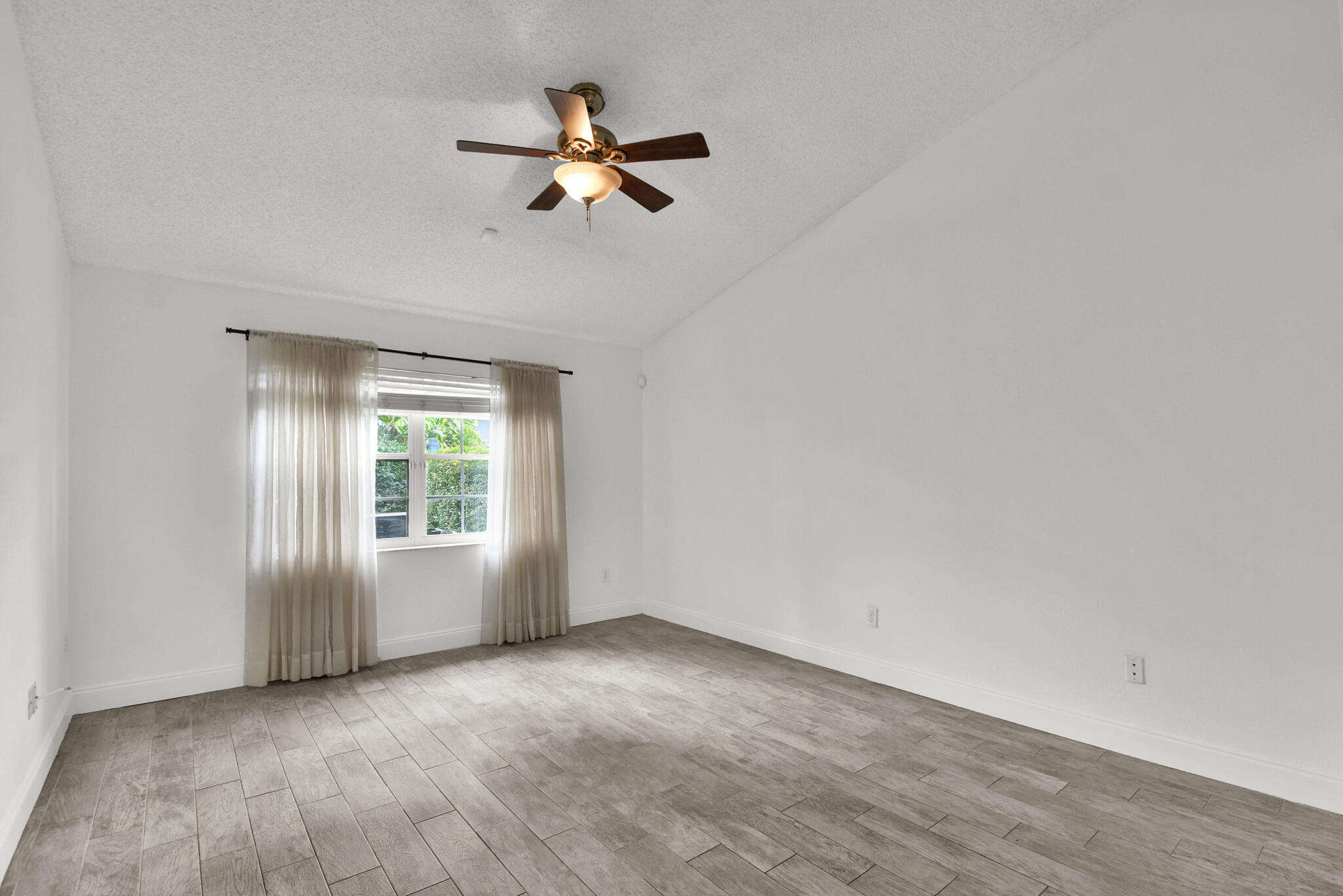13175 Quiet Woods Road, Unit A Wellington, FL 33414 - Photo 14 of 46 a view of an empty room with a window
