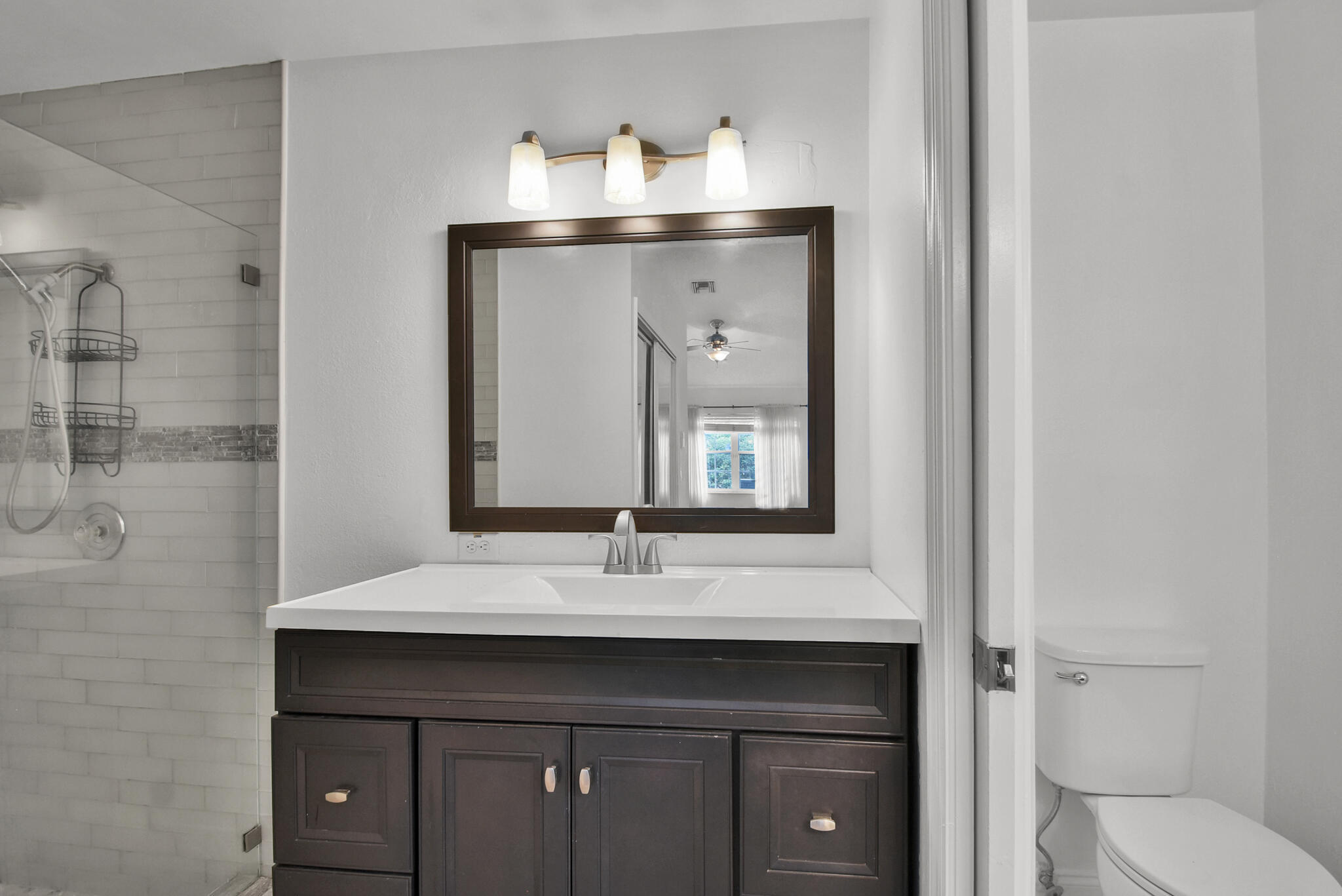 13175 Quiet Woods Road, Unit A Wellington, FL 33414 - Photo 17 of 46 a bathroom with a sink vanity and a mirror