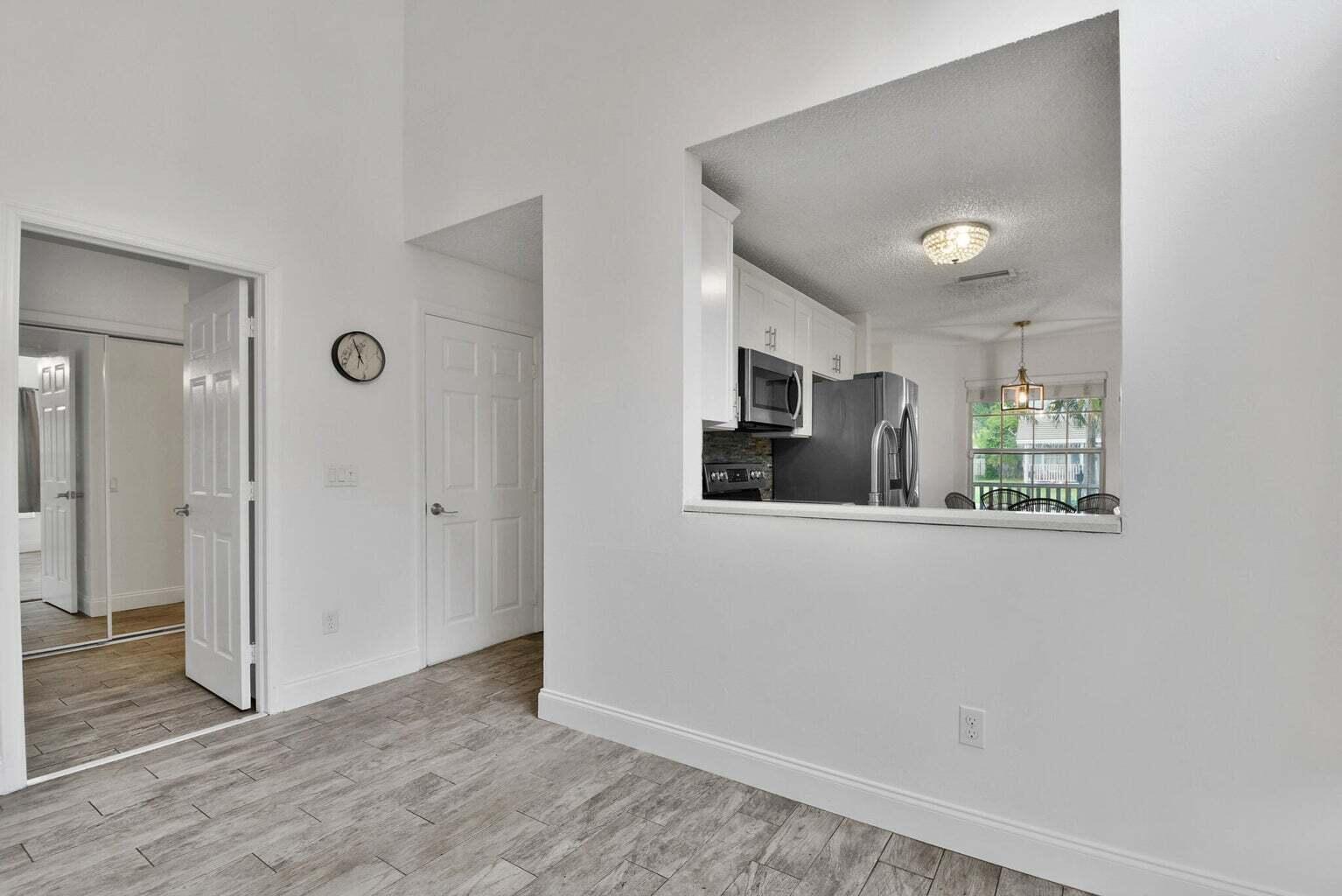13175 Quiet Woods Road, Unit A Wellington, FL 33414 - Photo 18 of 46 a view of kitchen with wooden floor