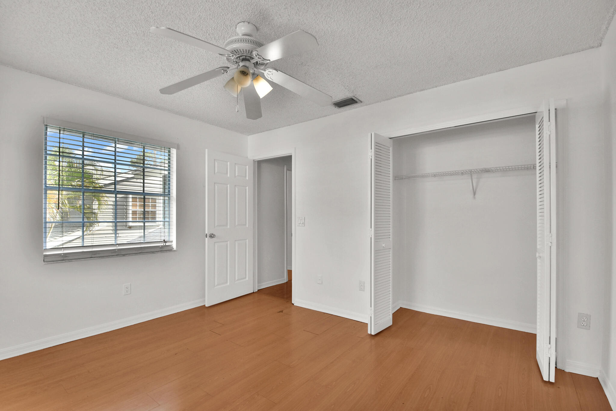 13175 Quiet Woods Road, Unit A Wellington, FL 33414 - Photo 29 of 46 a view of an empty room with a window