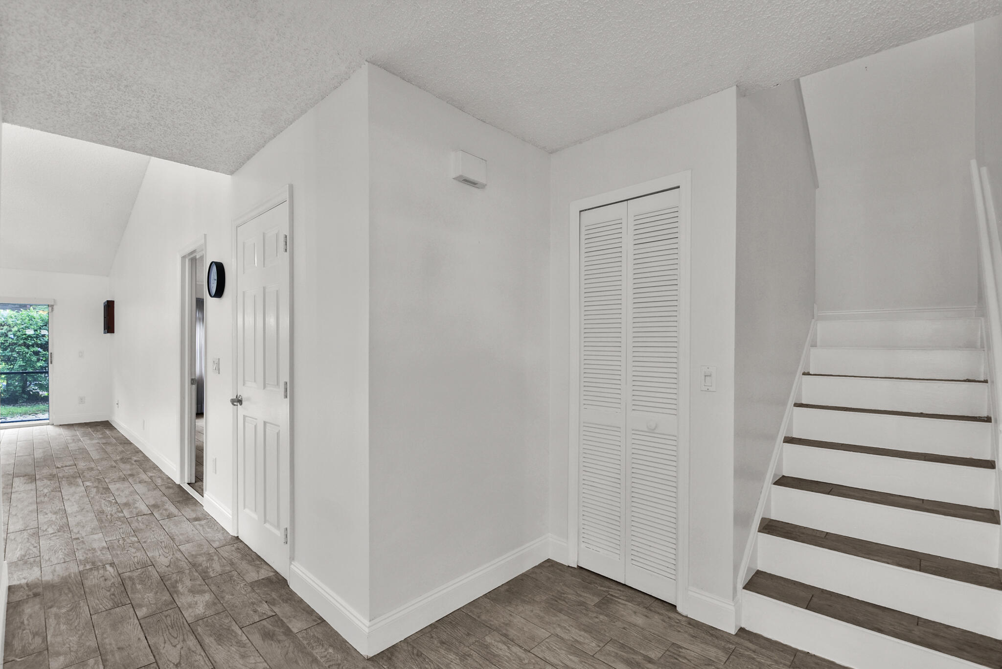 13175 Quiet Woods Road, Unit A Wellington, FL 33414 - Photo 35 of 46 a view of a hallway with wooden floor and entryway