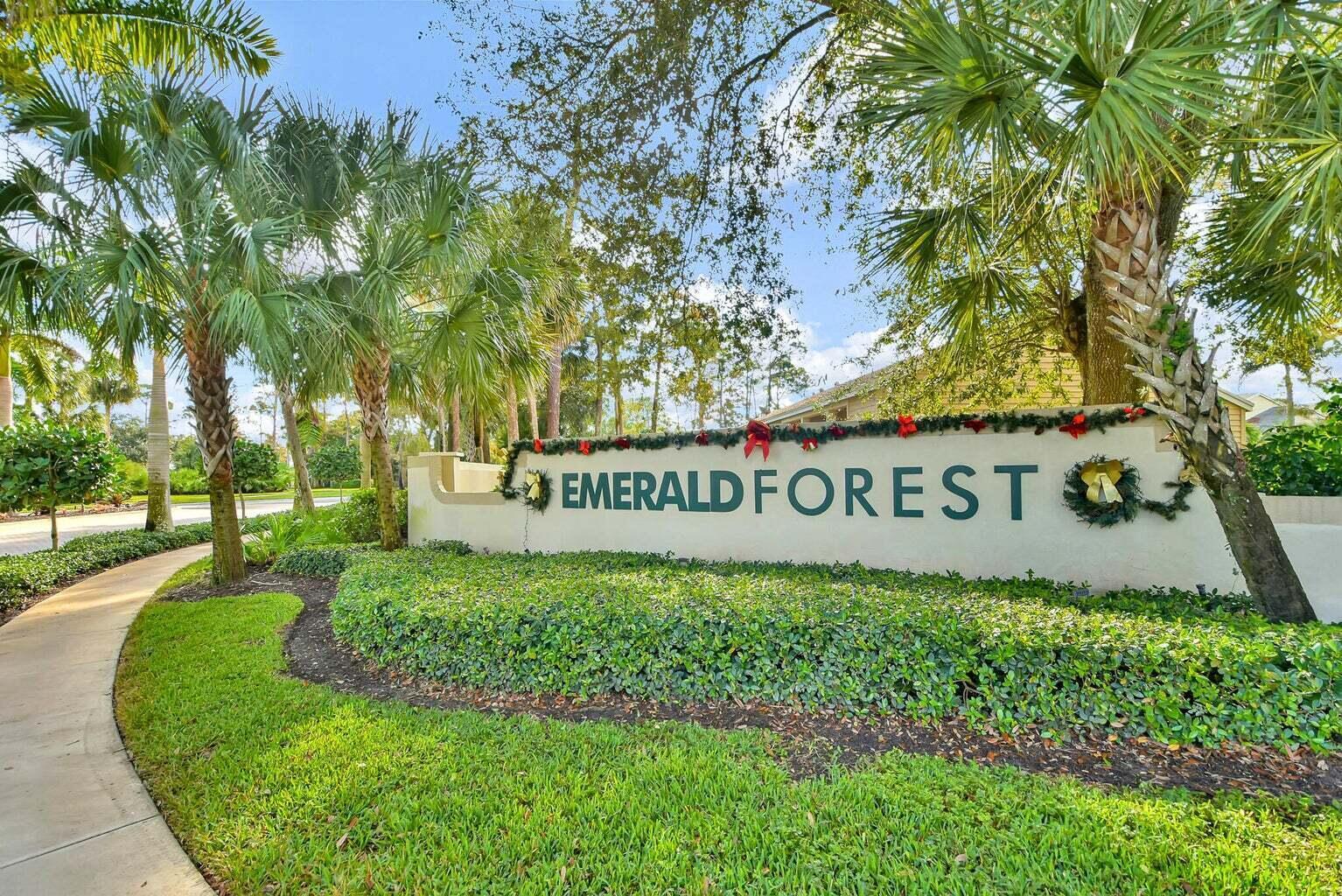 13175 Quiet Woods Road, Unit A Wellington, FL 33414 - Photo 36 of 46 a sign of golf club on a wall under a tree