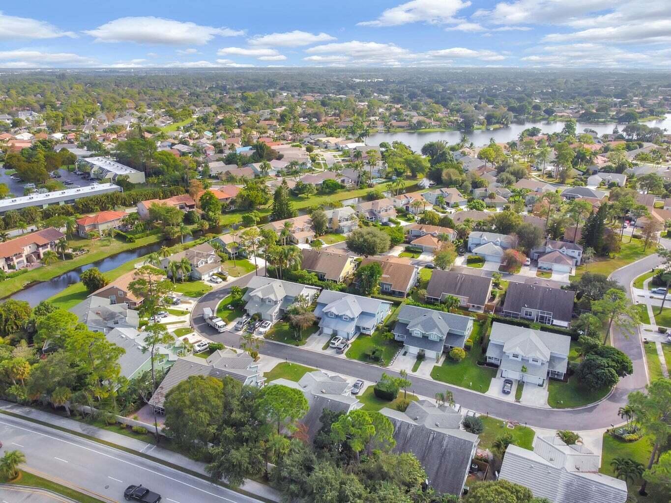13175 Quiet Woods Road, Unit A Wellington, FL 33414 - Photo 40 of 46 an aerial view of residential houses with outdoor space