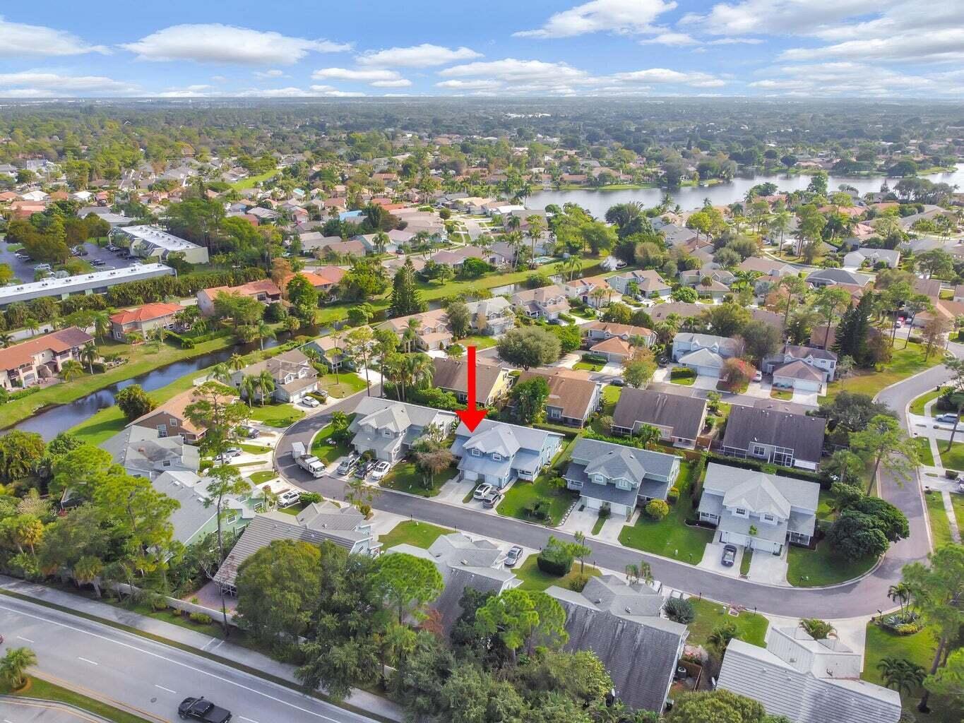13175 Quiet Woods Road, Unit A Wellington, FL 33414 - Photo 42 of 46 an aerial view of residential houses with outdoor space