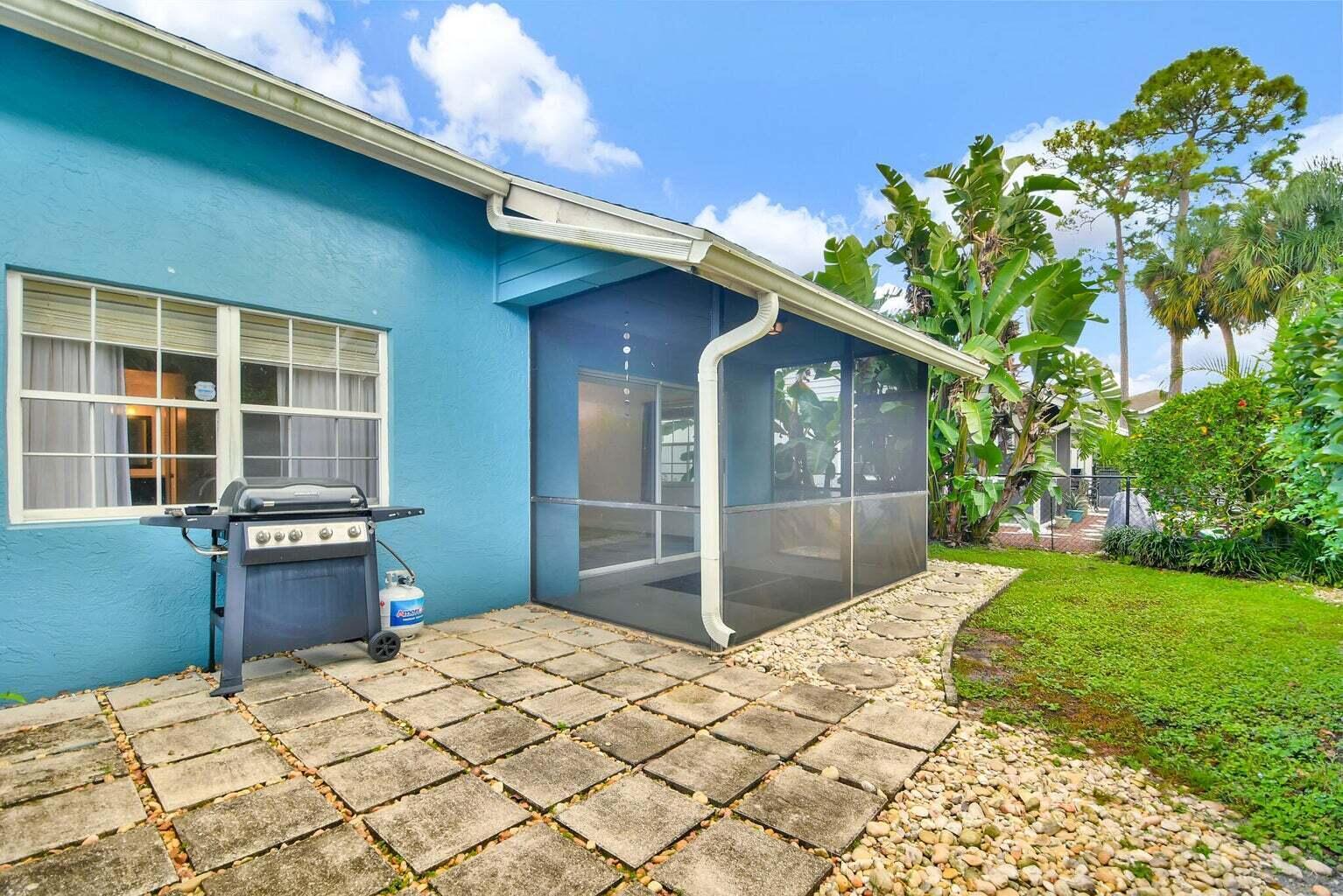 13175 Quiet Woods Road, Unit A Wellington, FL 33414 - Photo 43 of 46 a house view with a backyard space