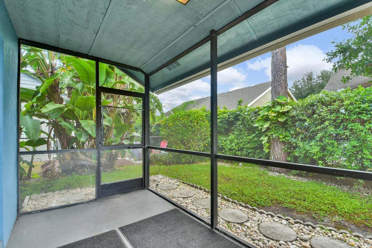 13175 Quiet Woods Road, Unit A Wellington, FL 33414 - Photo 46 of 46 a view of a yard with porch