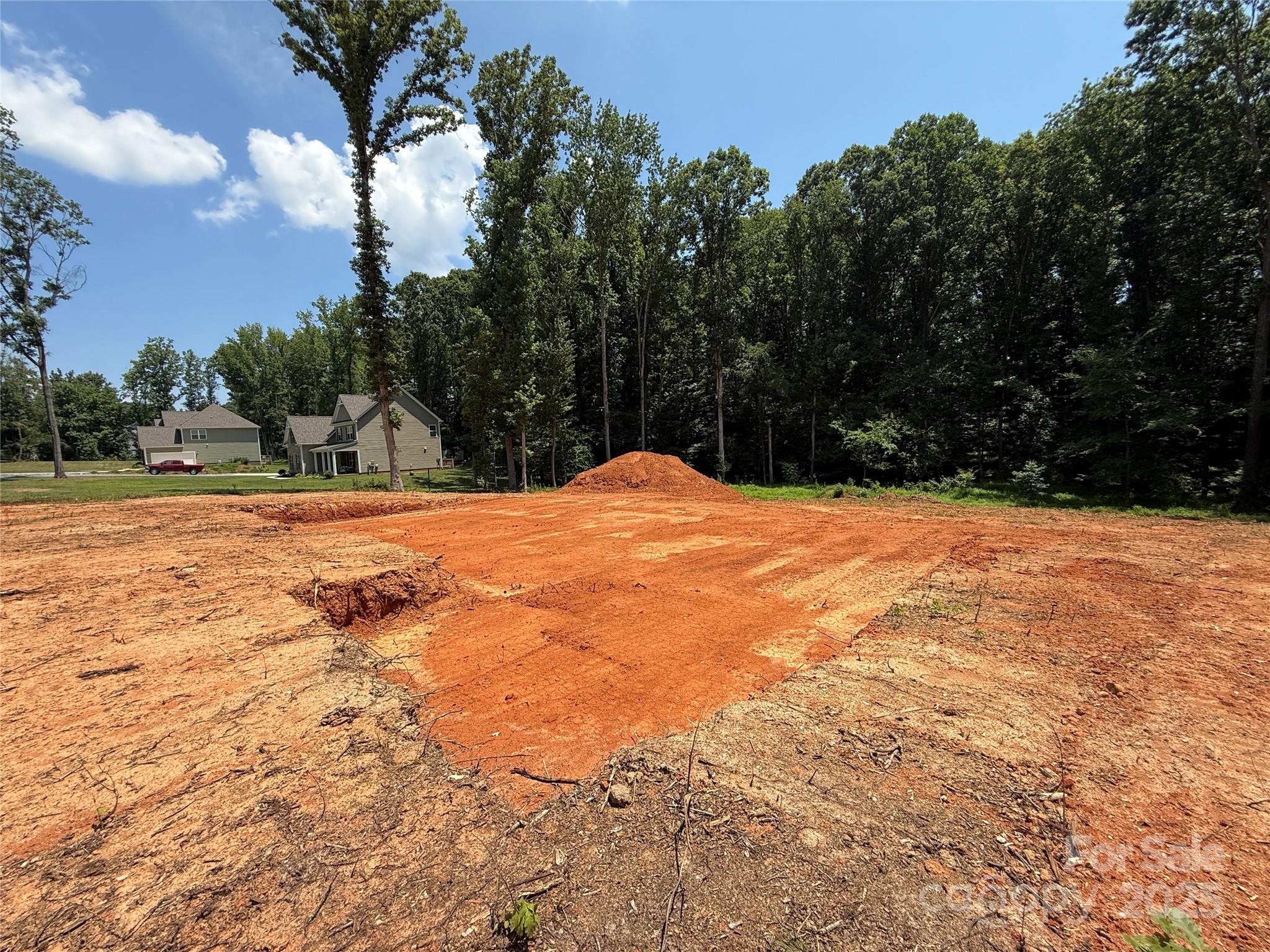 219 Barra Drive, Unit 4 Waxhaw, NC 28173 - Photo 22 of 23 a view of pool with trees in the background