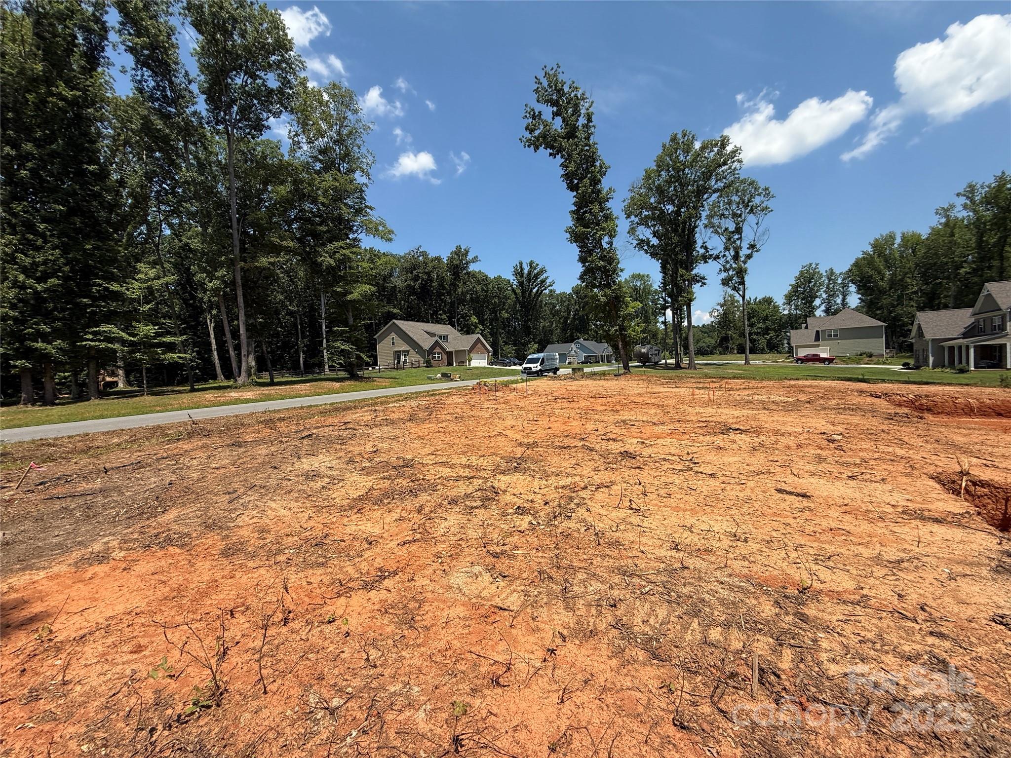 219 Barra Drive, Unit 4 Waxhaw, NC 28173 - Photo 23 of 23 a swimming pool with trees in the background
