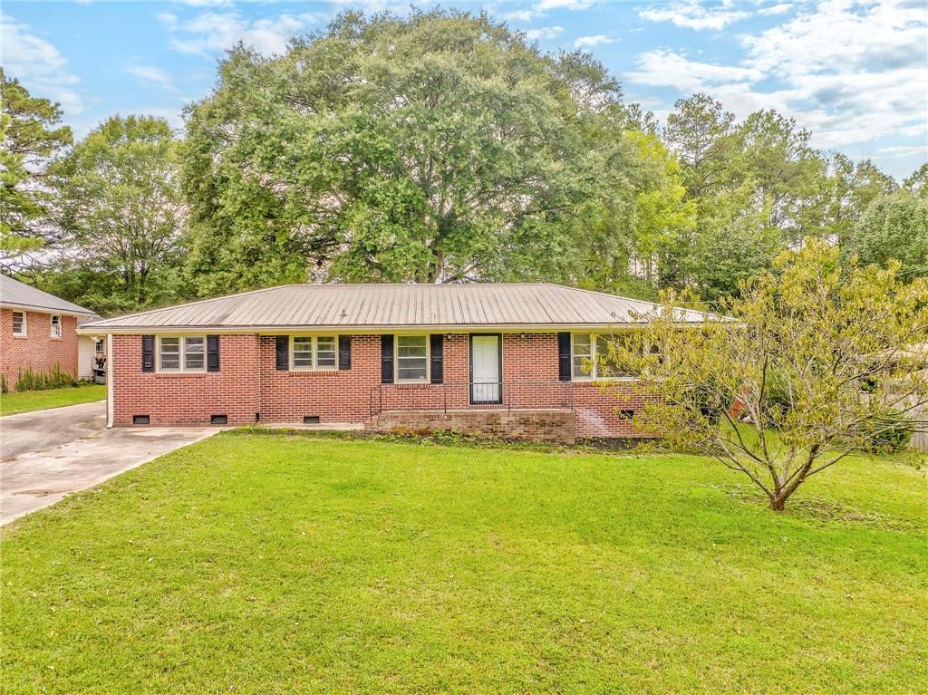 21 Anders Road Southwest Rome, GA 30165 - Photo 1 of 1 a front view of a house with a garden