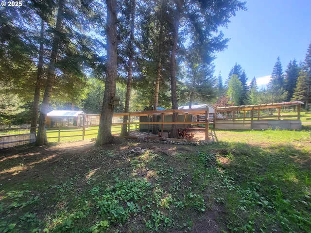a view of a yard with swimming pool