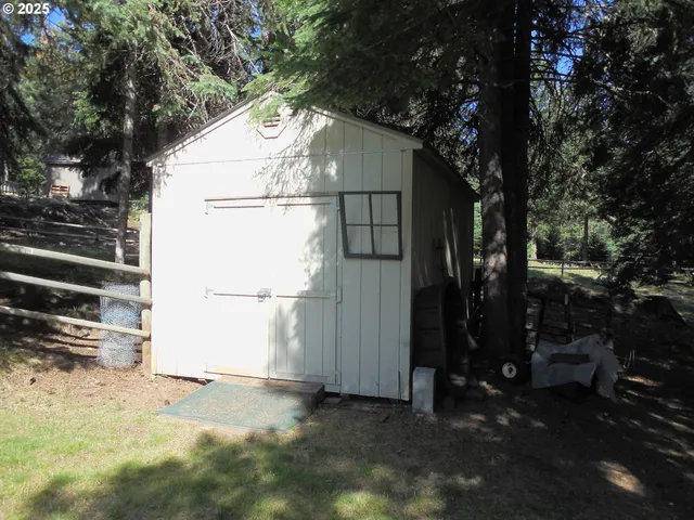 a view of a house with a tree