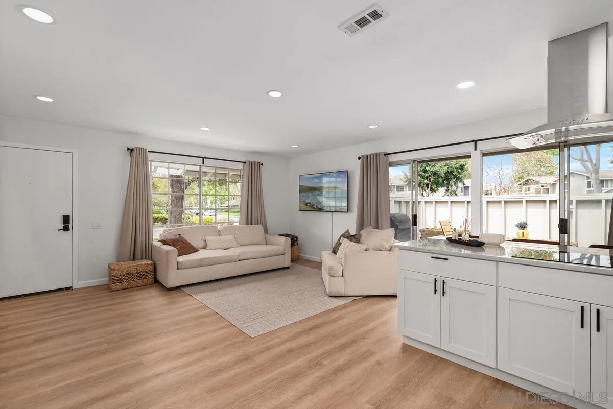 751 Pyramid Point Way Oceanside, CA 92058 - Photo 14 of 30 a living room with furniture and a large window