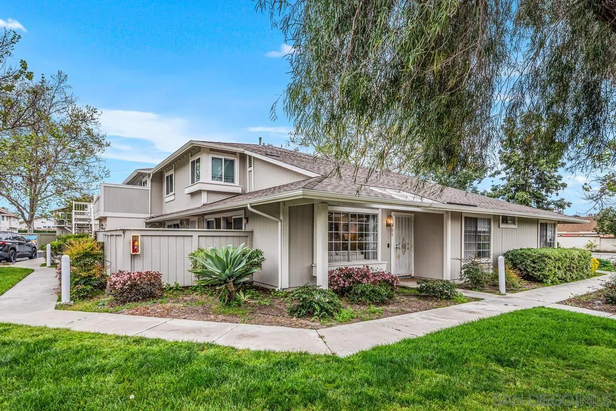 751 Pyramid Point Way Oceanside, CA 92058 - Photo 2 of 30 a front view of a house with a garden