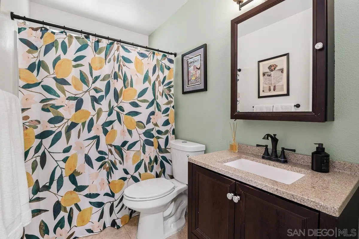 751 Pyramid Point Way Oceanside, CA 92058 - Photo 23 of 30 a bathroom with a sink and a toilet