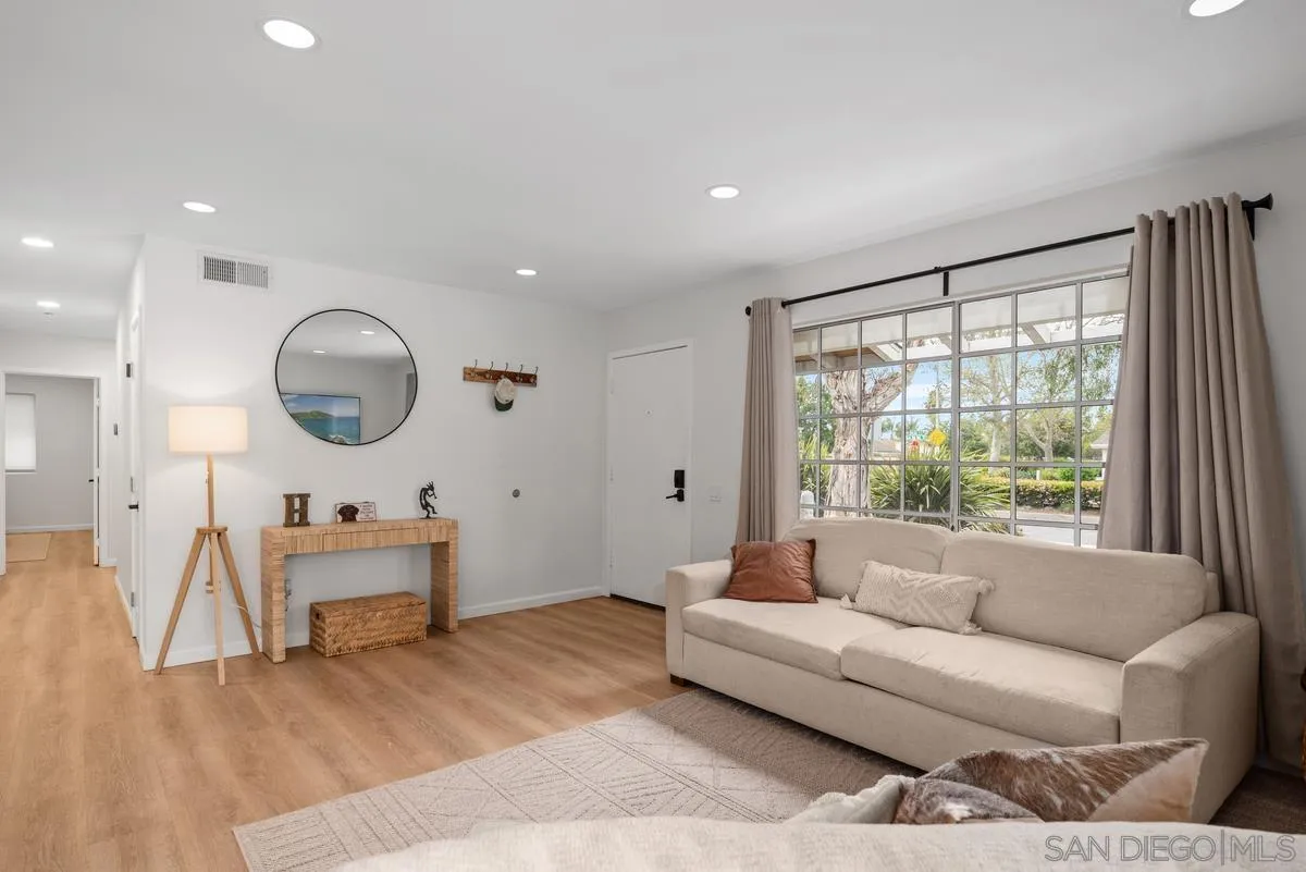 751 Pyramid Point Way Oceanside, CA 92058 - Photo 6 of 30 a living room with furniture and a large window