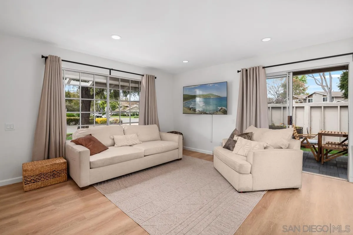 751 Pyramid Point Way Oceanside, CA 92058 - Photo 7 of 30 a living room with furniture and a large window