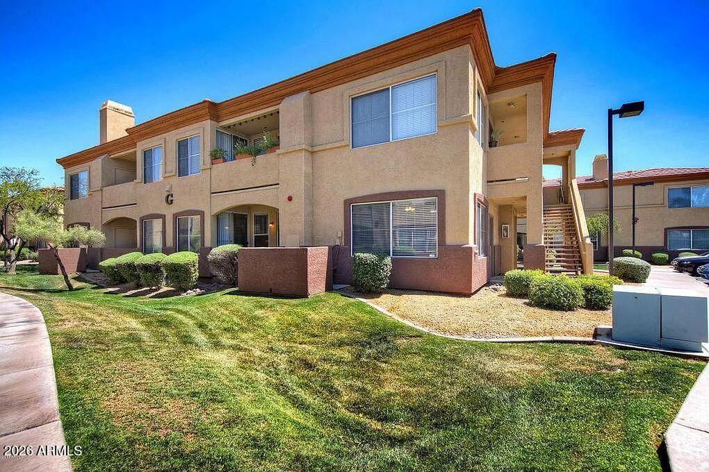 2134 East Broadway Road, Unit 1039 Tempe, AZ 85282 - Photo 2 of 24 a view of a house with backyard and sitting area