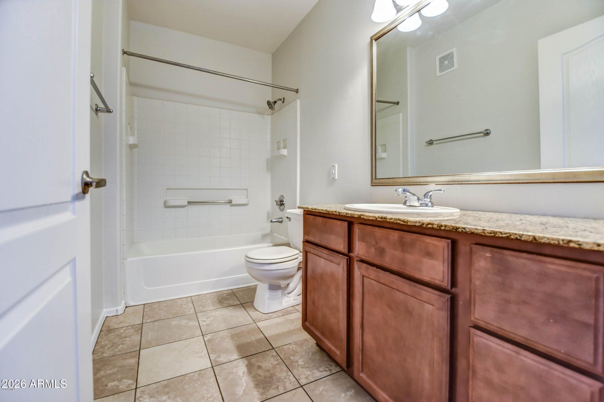 2134 East Broadway Road, Unit 1039 Tempe, AZ 85282 - Photo 22 of 24 a bathroom with a sink toilet and shower