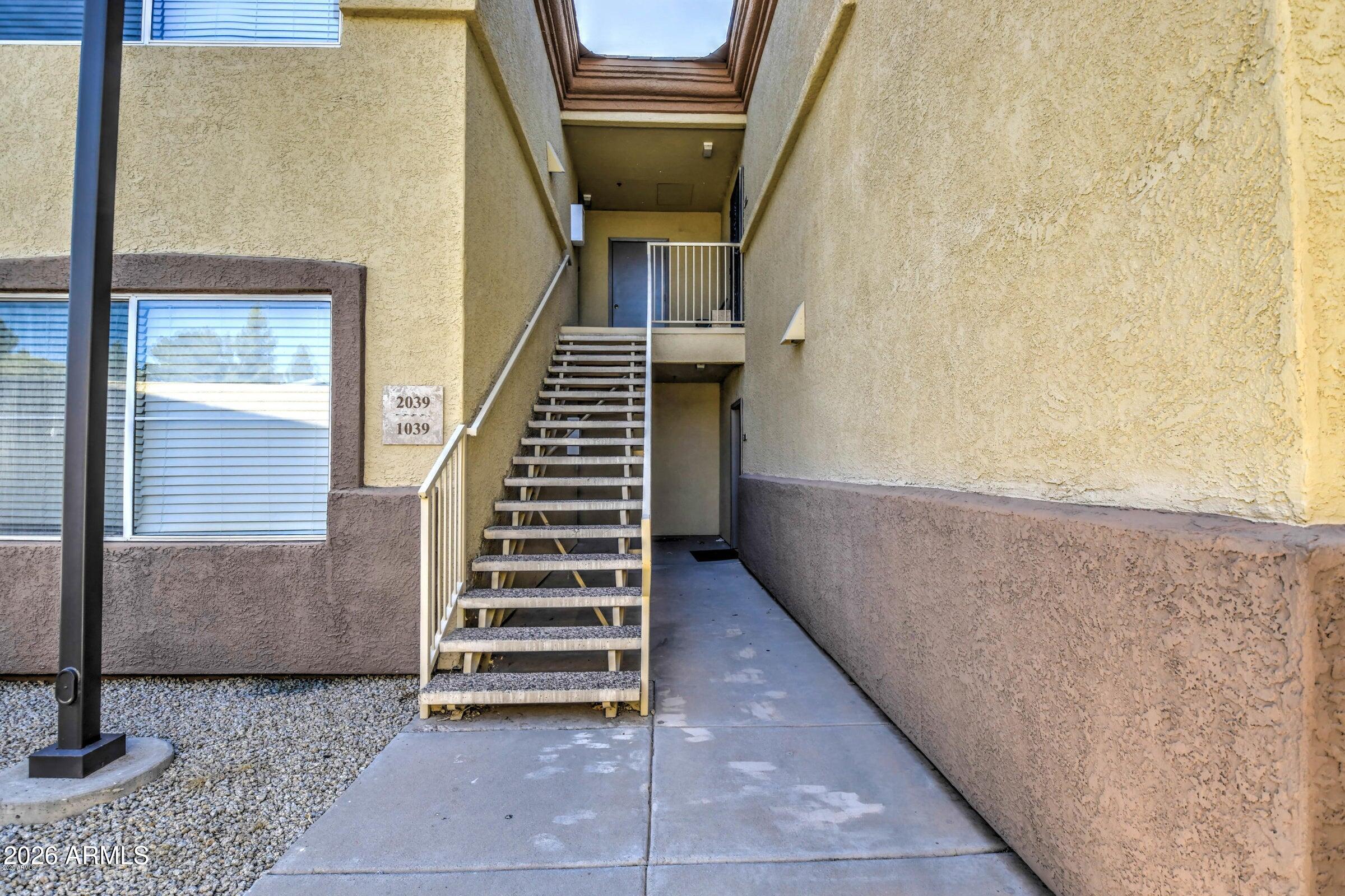 2134 East Broadway Road, Unit 1039 Tempe, AZ 85282 - Photo 3 of 24 a view of entryway and hall with wooden floor