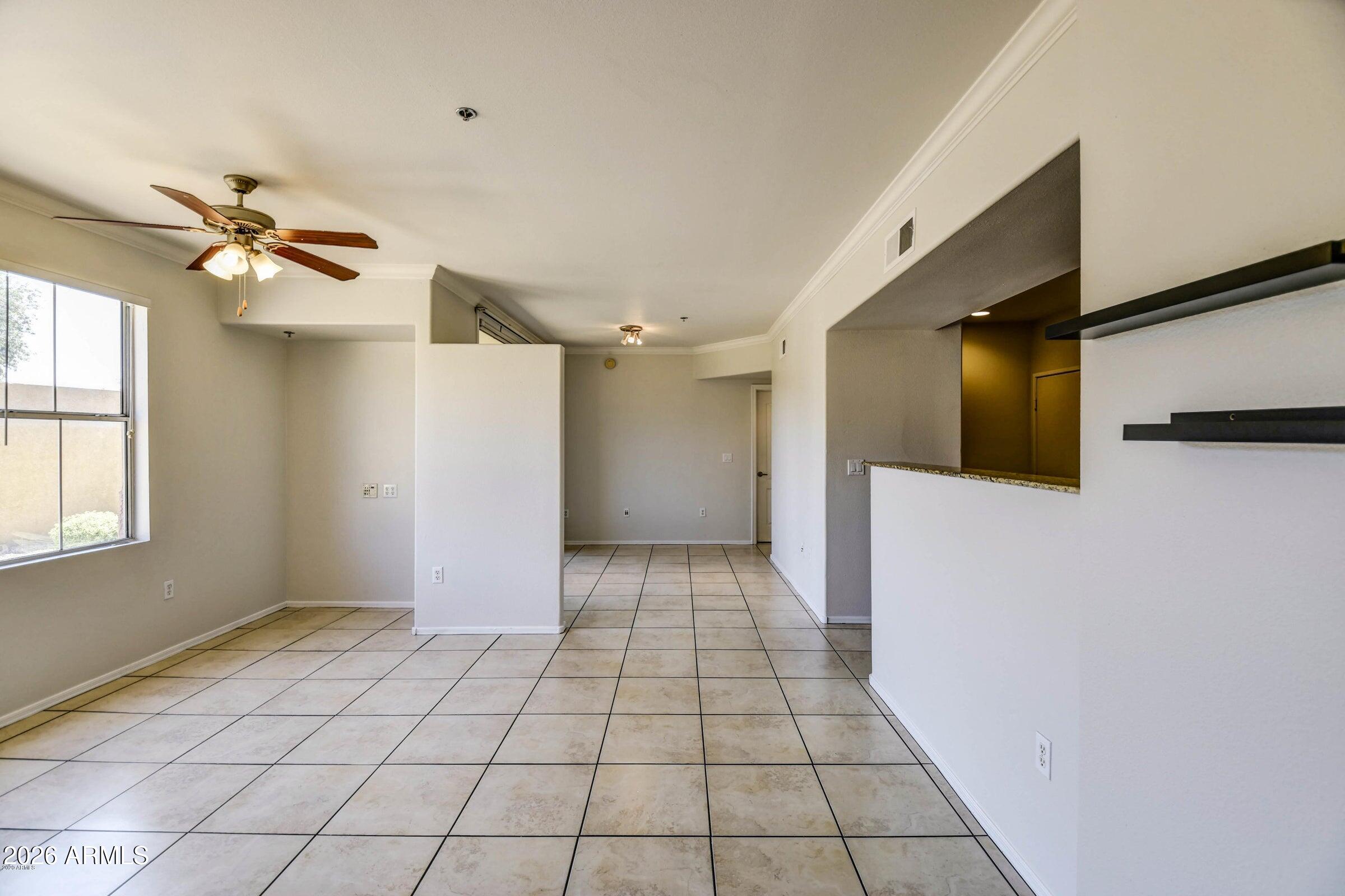 2134 East Broadway Road, Unit 1039 Tempe, AZ 85282 - Photo 5 of 24 a view of a livingroom with an empty space