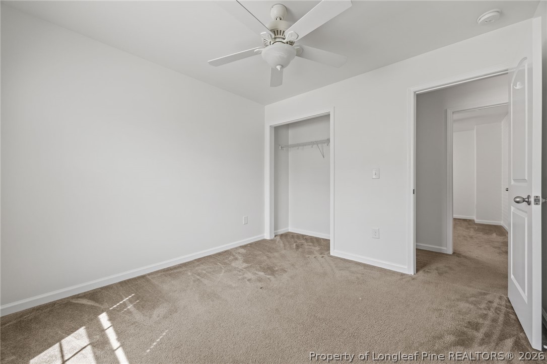 226 River Oak Street Spring Lake, NC 28390 - Photo 35 of 41 an empty room with fan and a ceiling fan