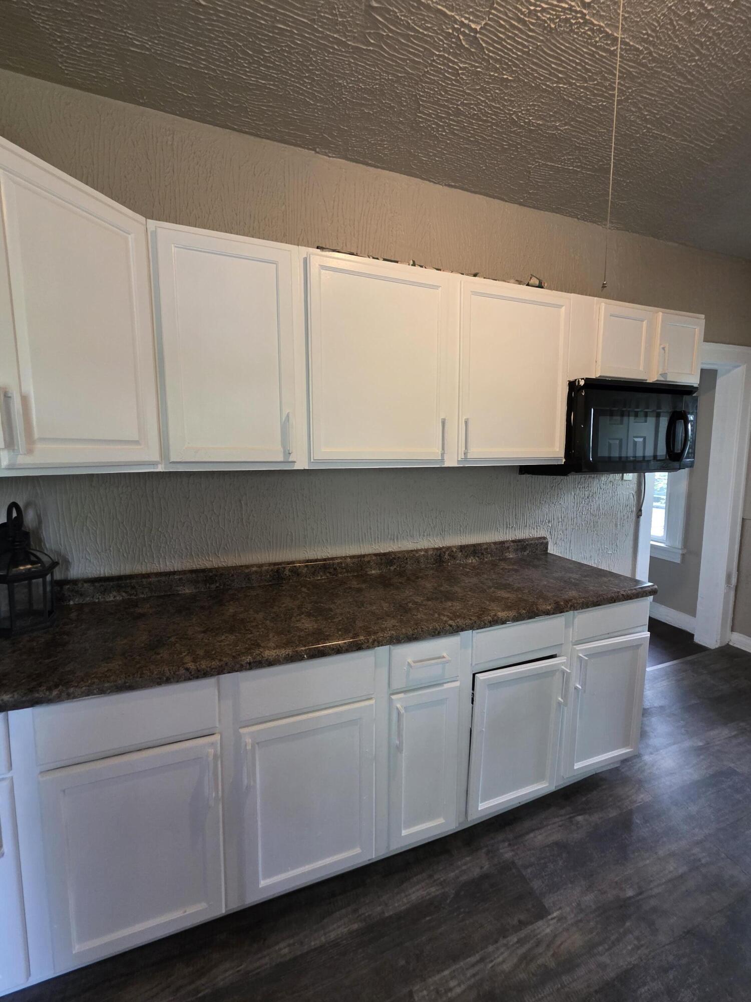 3946 Connecticut Street Gary, IN 46409 - Photo 12 of 20 a kitchen with granite countertop a sink and cabinets
