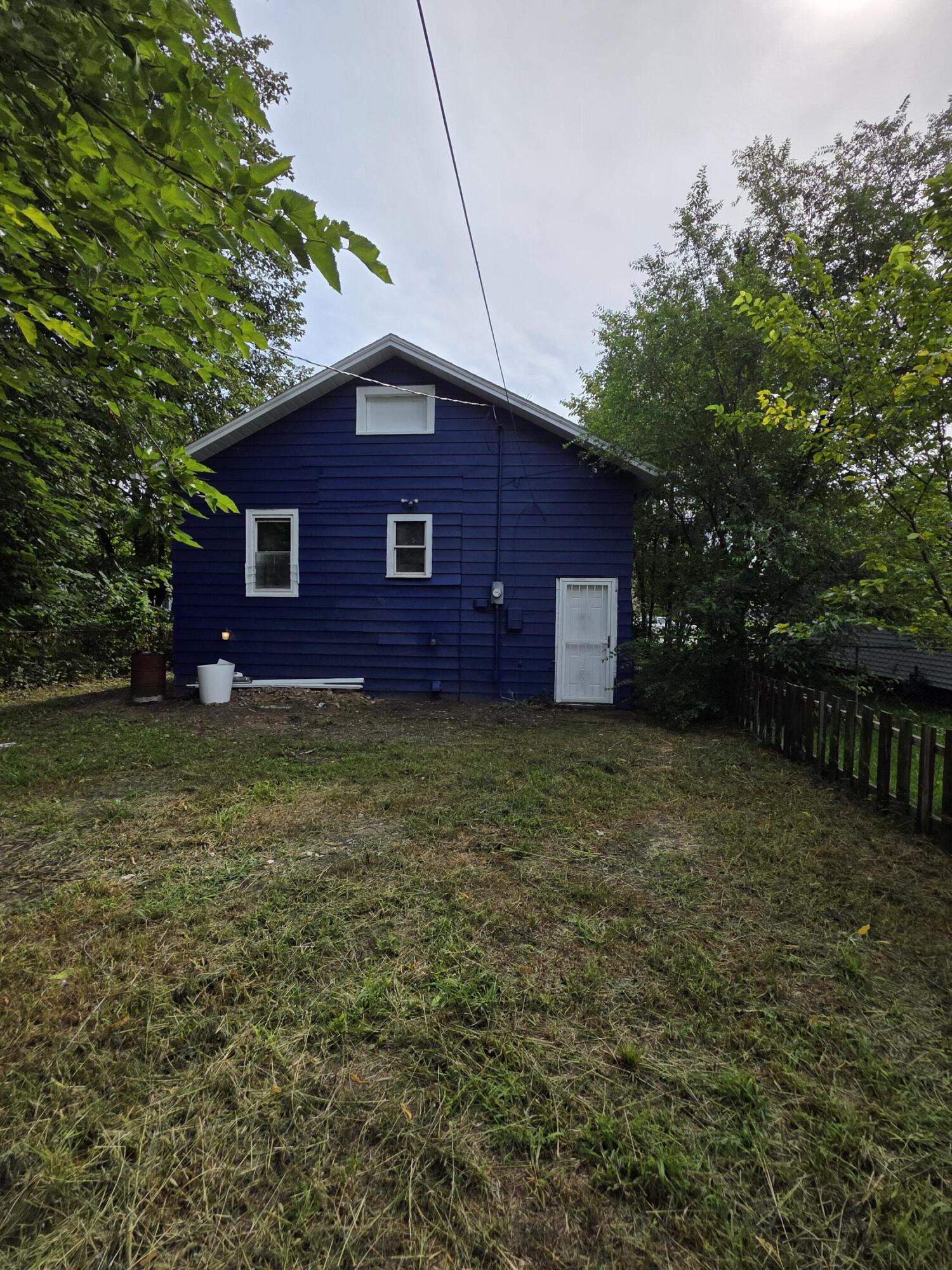 3946 Connecticut Street Gary, IN 46409 - Photo 20 of 20 a brick house with a yard plants and large tree