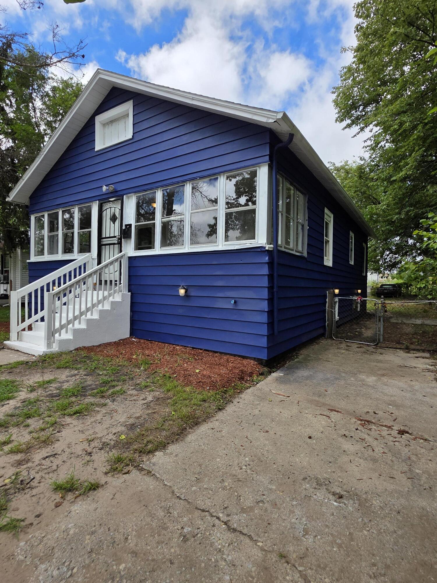 3946 Connecticut Street Gary, IN 46409 - Photo 2 of 20 a front view of a house with a yard