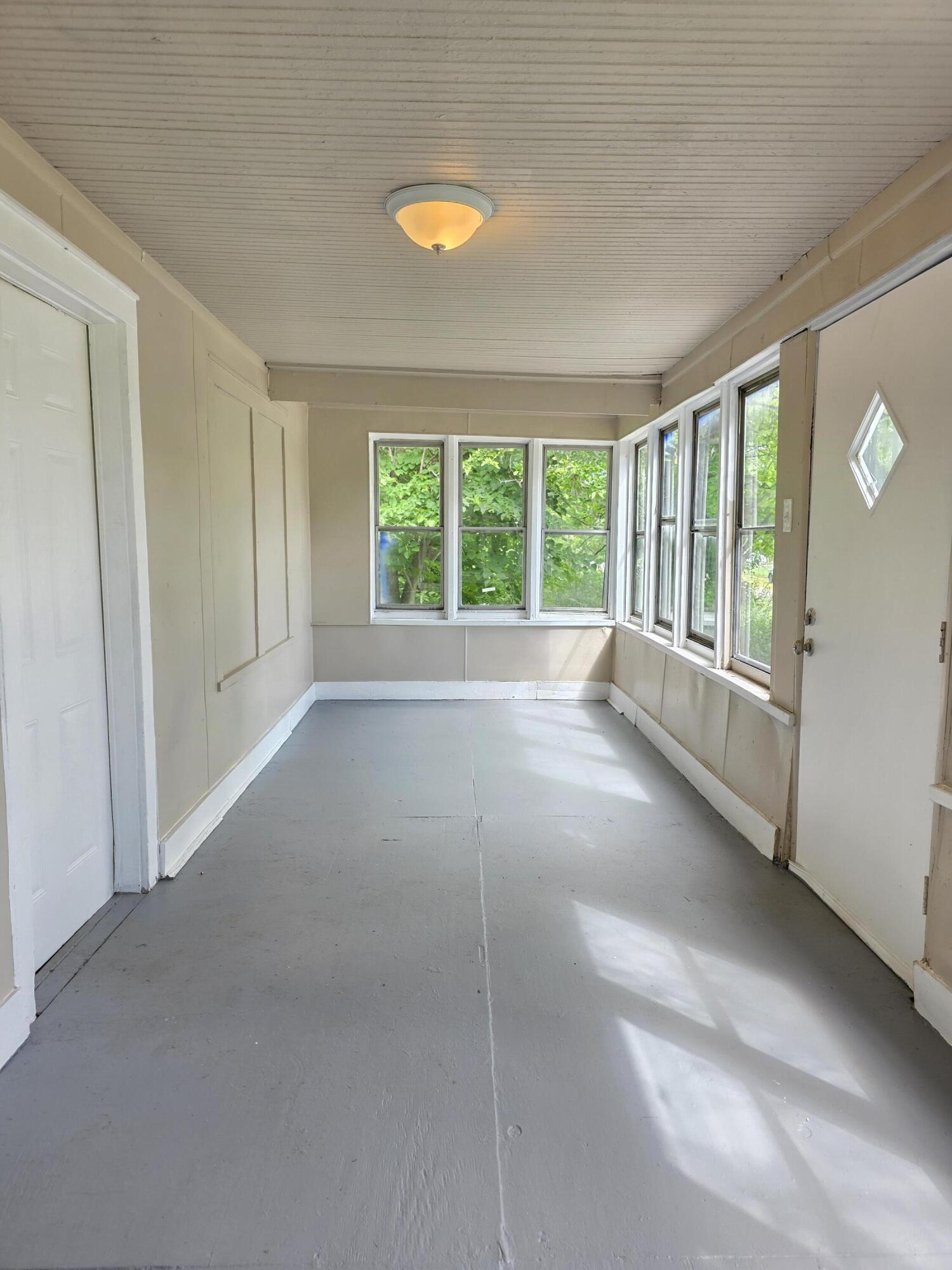 3946 Connecticut Street Gary, IN 46409 - Photo 3 of 20 a view of an empty room with a window