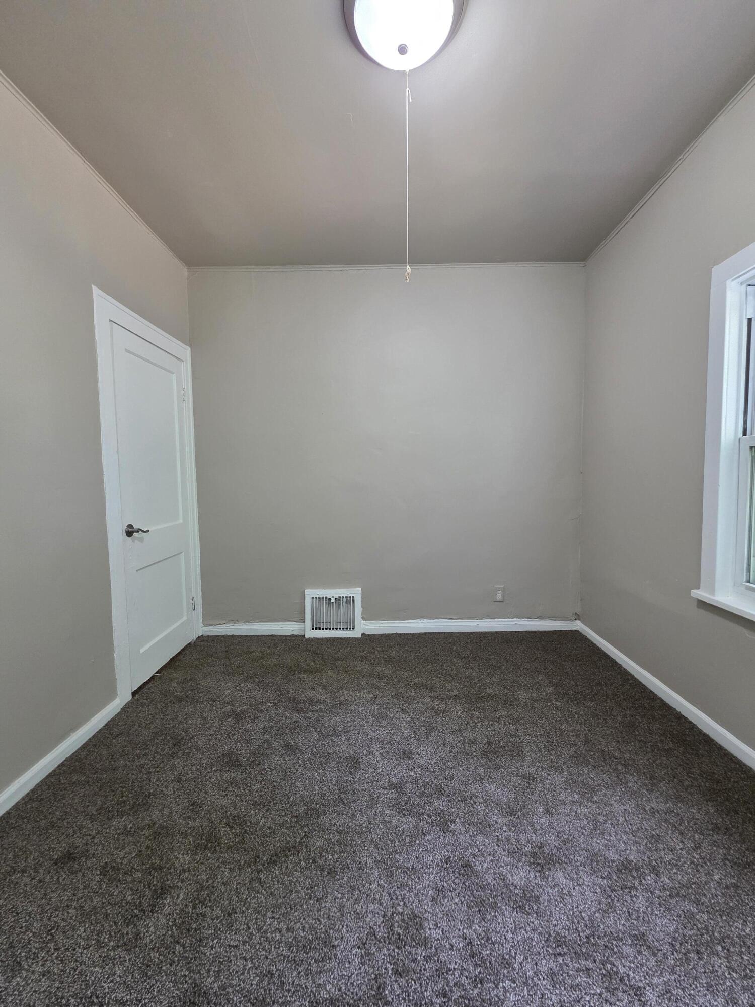 3946 Connecticut Street Gary, IN 46409 - Photo 10 of 20 an empty room with a empty space and window