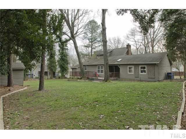 2824 Pidgeon Hill Road Raleigh, NC 27613 - Photo 14 of 14 a front view of a house with a garden