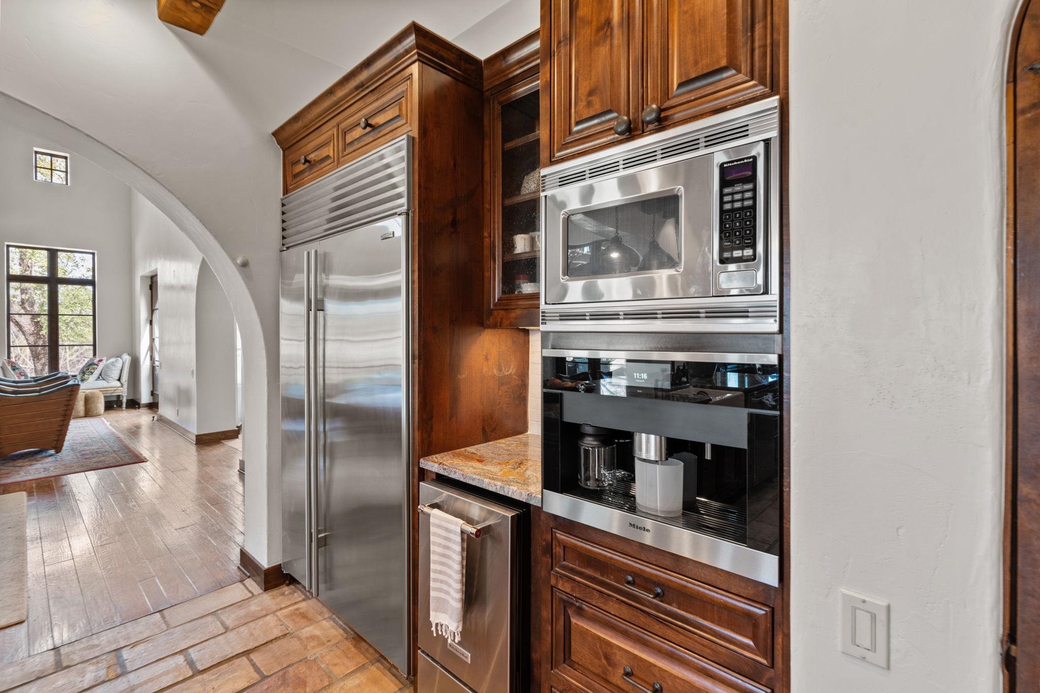 119 Plaza Escondido Horseshoe Bay, TX 78657 - Photo 11 of 30 a kitchen with stainless steel appliances granite countertop a stove and a refrigerator