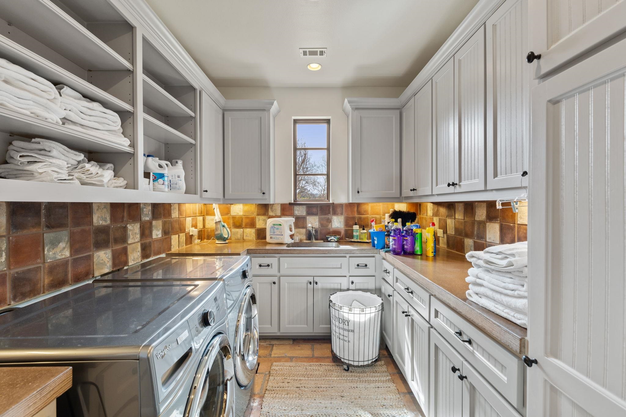 119 Plaza Escondido Horseshoe Bay, TX 78657 - Photo 16 of 30 a kitchen with a sink and cabinets