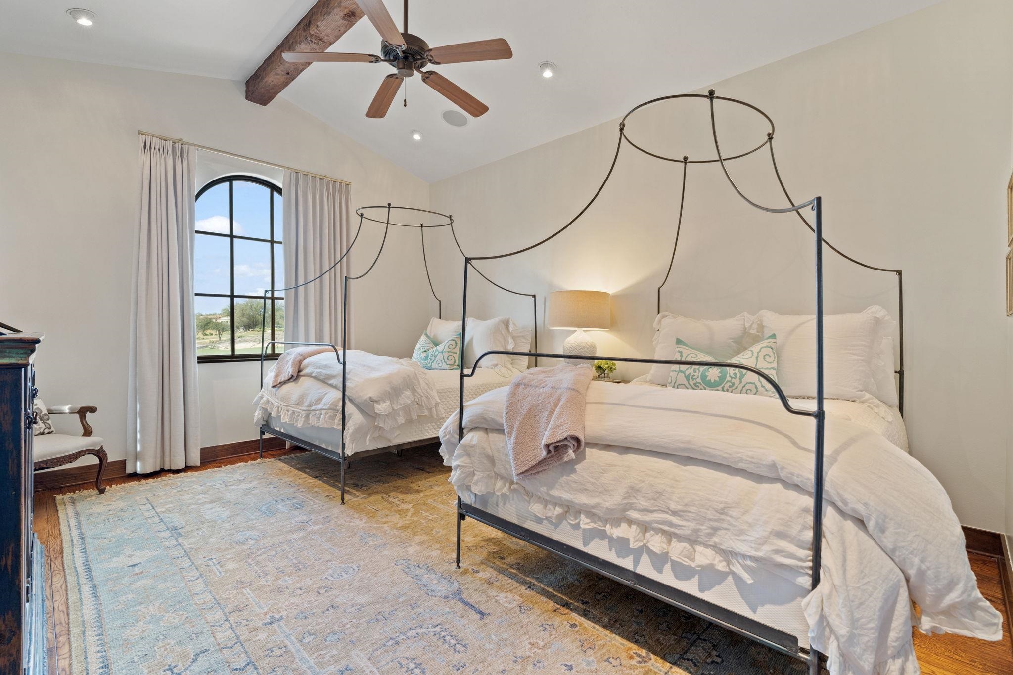 119 Plaza Escondido Horseshoe Bay, TX 78657 - Photo 18 of 30 a bedroom with a bed and window