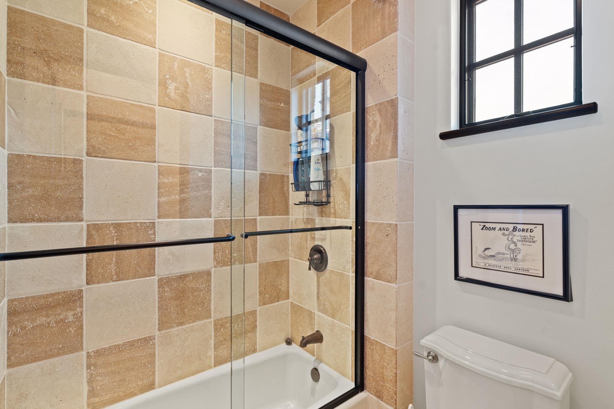 119 Plaza Escondido Horseshoe Bay, TX 78657 - Photo 21 of 30 a bathroom with a toilet and a shower