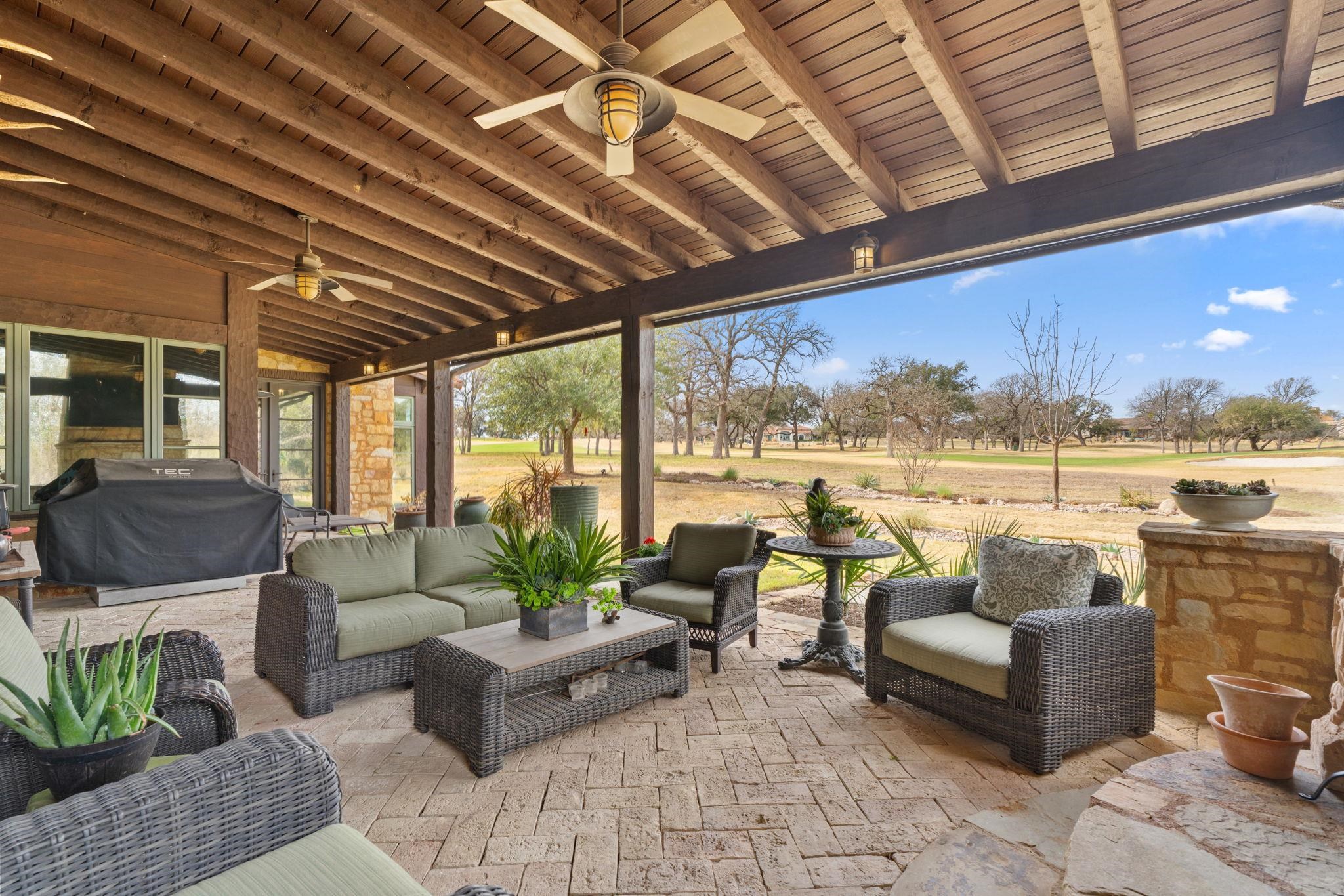 119 Plaza Escondido Horseshoe Bay, TX 78657 - Photo 24 of 30 a living room with furniture and a floor to ceiling window