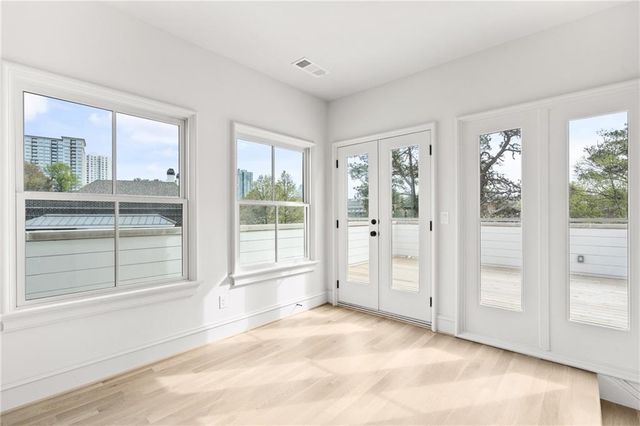 a view of a patio with table and chairs and potted plants