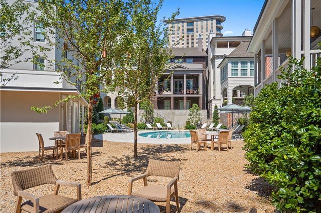 a view of a house with a flower garden