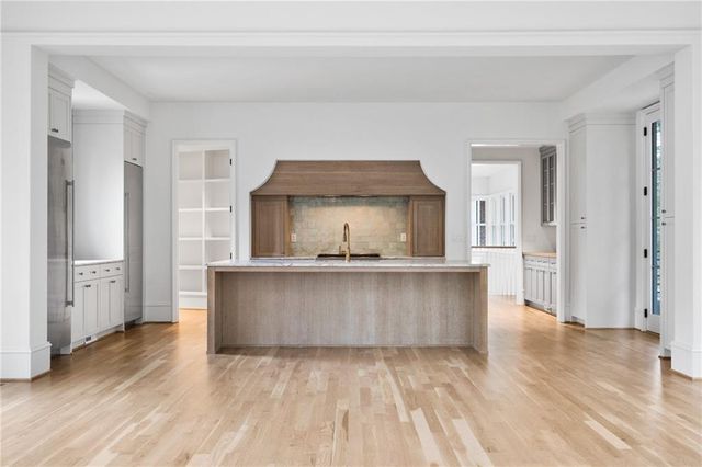 a living room with a furniture and a wooden floor