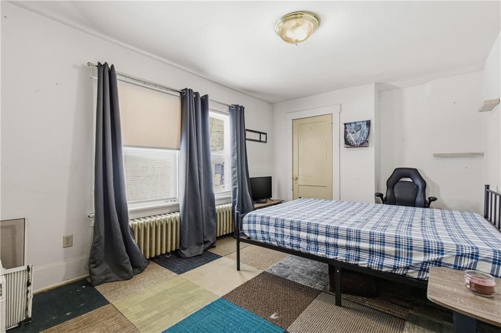 526 Dippold Avenue Baden, PA 15005 - Photo 17 of 26 a bedroom with a bed and a window