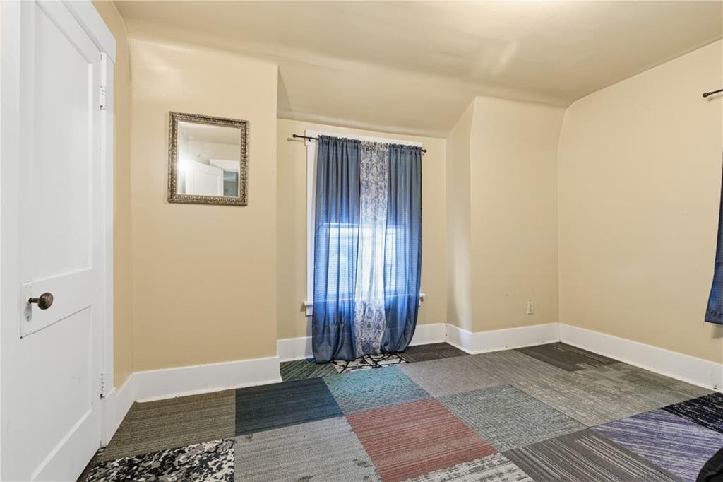 526 Dippold Avenue Baden, PA 15005 - Photo 20 of 26 an empty room with wooden floor and windows