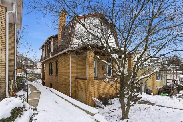 a view of a building with a snow